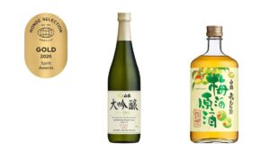 Gold 2026 Spirit Awards badge on the left, a bottle of Dai Ginjo sake in the center, and a Japanese fruit-flavored liqueur bottle on the right.
